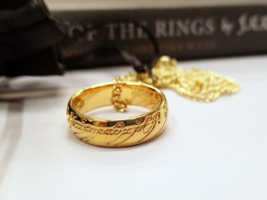 The One Ring, also called The Ruling Ring and Isildur's Bane, is crafted in solid bronze by the Badali Jewelry artists and then barrel plated with pure 24k gold. Each One Ring pendant has the appearance of solid gold, hence the name, Gollum Gold. Our Gollum Gold One Ring appeared in an episode of The Big Bang Theory.
