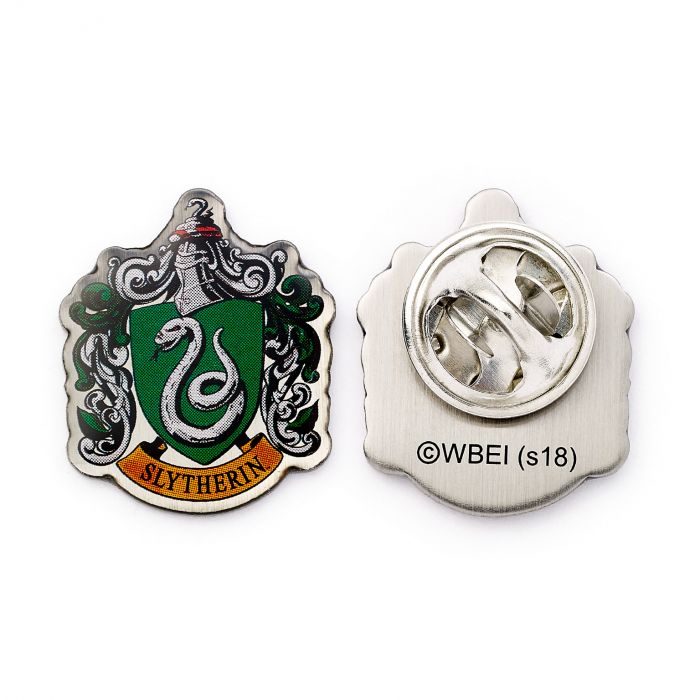 Slytherin House Shield Crest Pin Badge  The Crest of the famous Hogwarts House, founded by Salazar Slytherin  This Harry Potter Pin Badge has been created using the official style guide from Warner Bros.  Enamel Pin Details:  Around .75" tall and .5" wide (20mm x 16mm) Beautiful colors protected by a high-gloss finish Enamel pin arrives on a printed Harry Potter card backer Quality metal badge pin with butterfly clutch backing